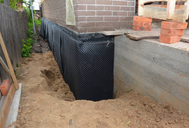 Happy homeowners after waterproofing job in Schofield